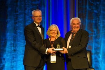 Merv & Lee receiving award